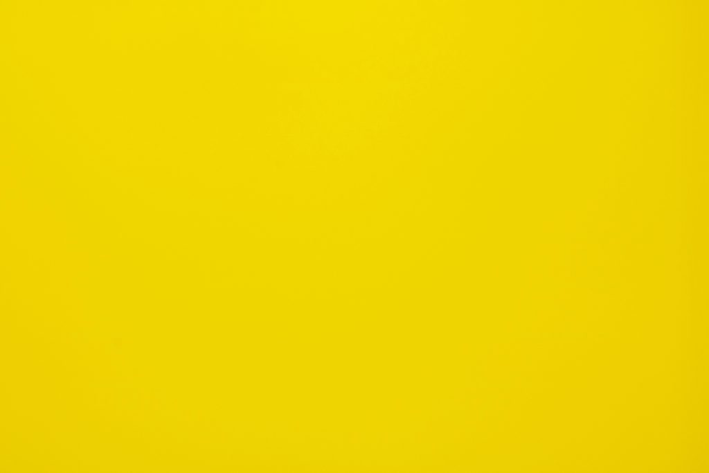 Bright yellow textured background, perfect for design projects and presentations.