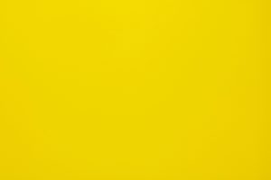 Bright yellow textured background, perfect for design projects and presentations.