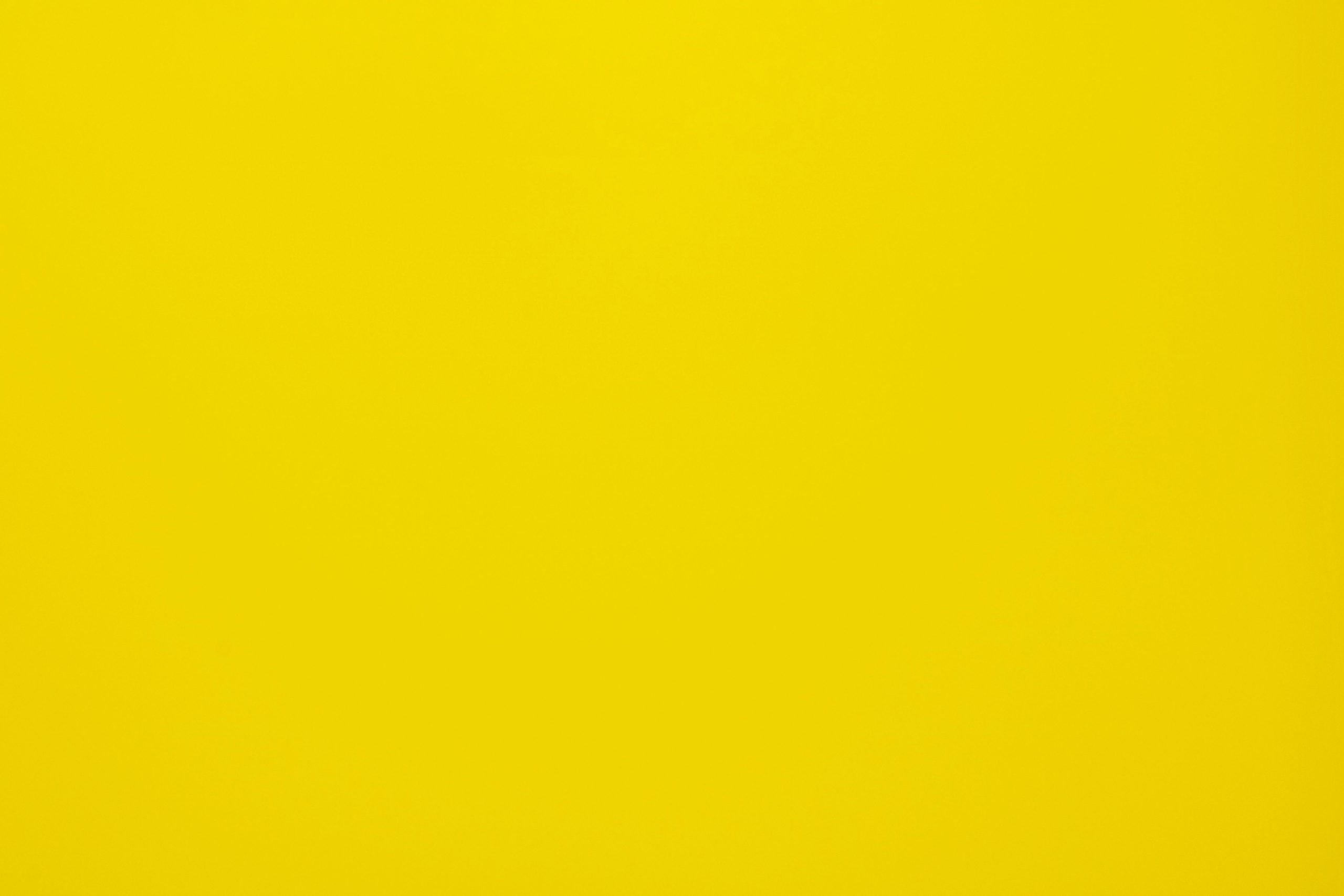 Bright yellow textured background, perfect for design projects and presentations.